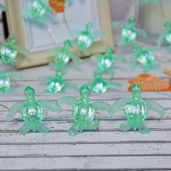 Sea turtle string lights arranged for nautical shelf decor