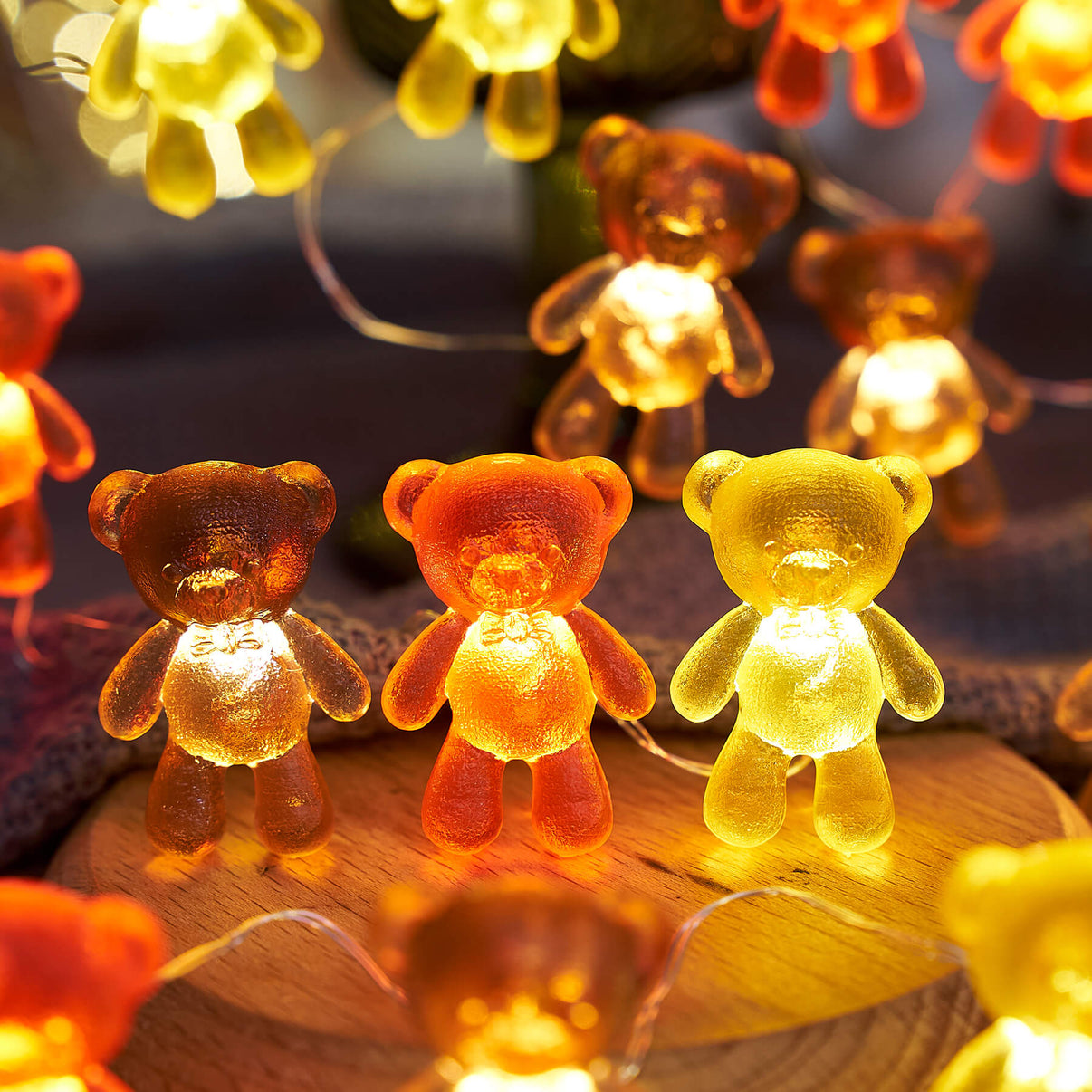 Cute teddy bear fairy lights glowing on shelf display